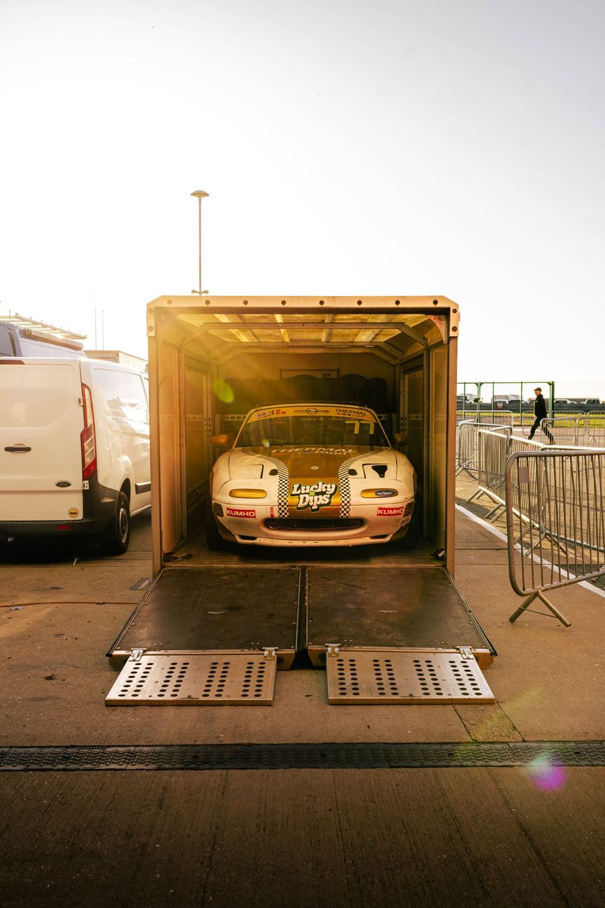 Race car being unloaded from a trailer