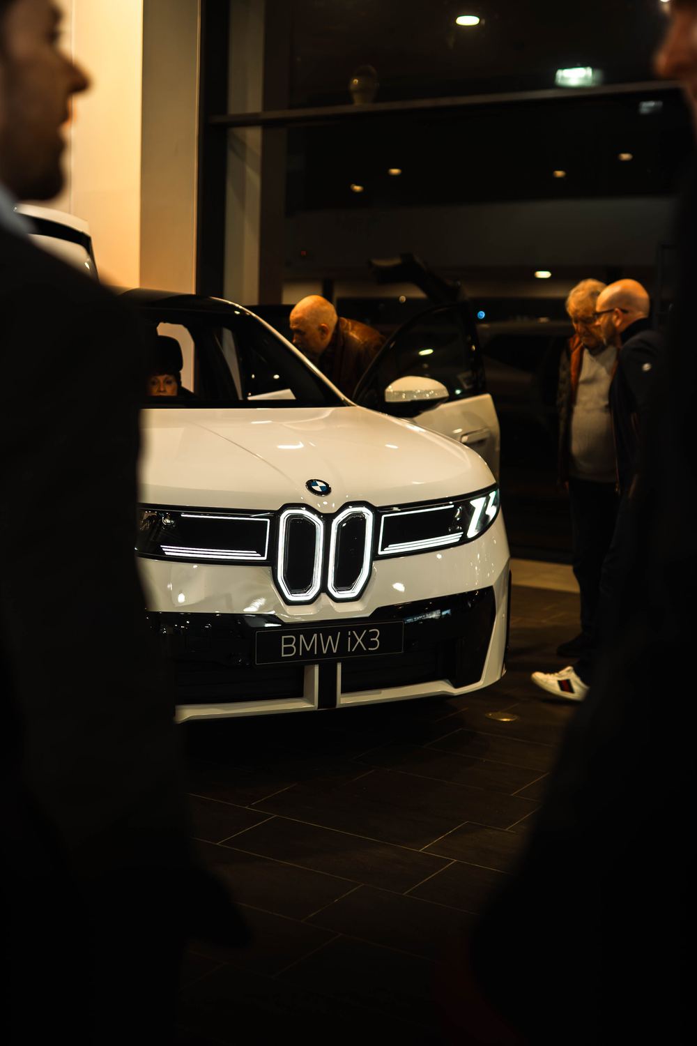 Guests gathered around the new BMW iX3 on launch night